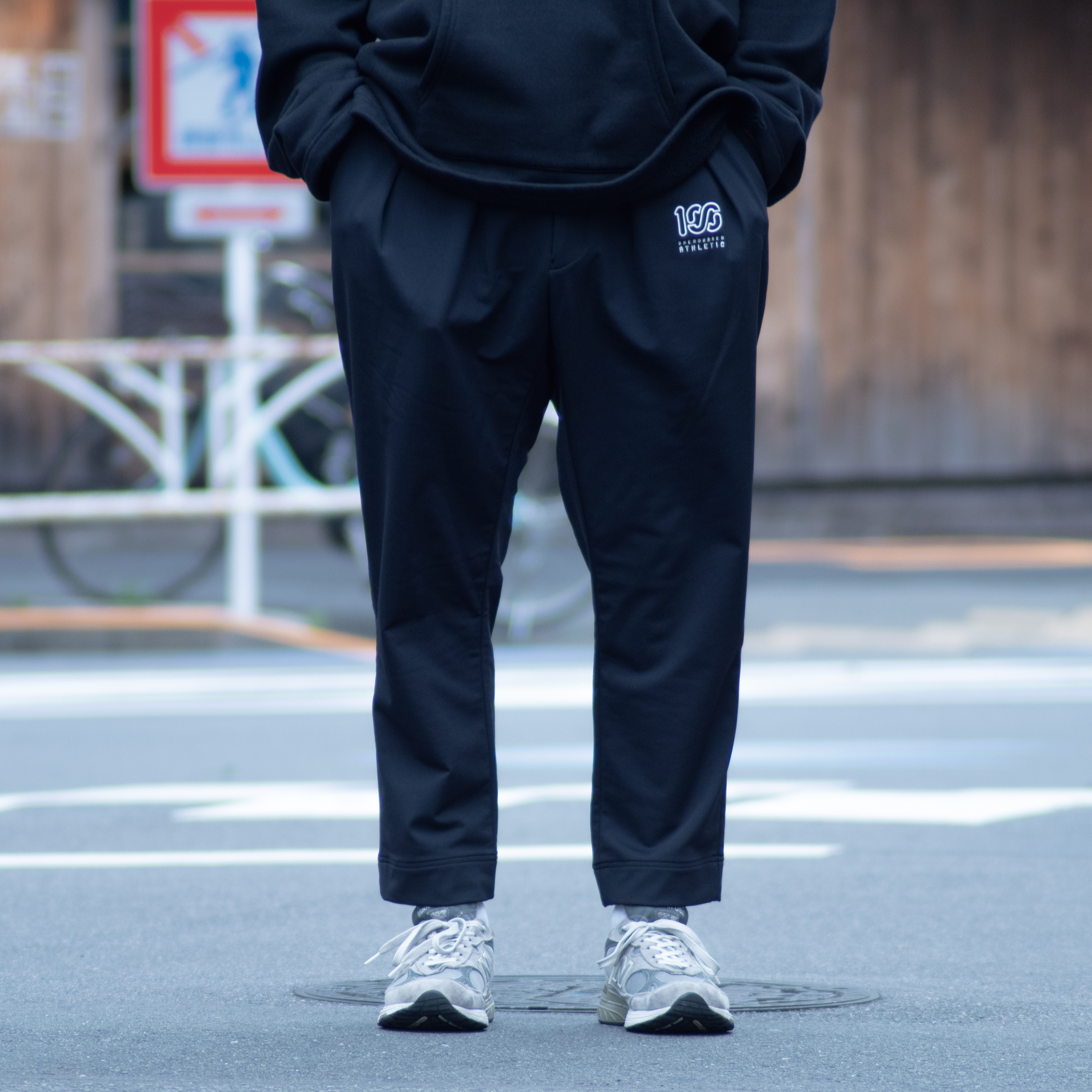 NEAT x 100A SPORTS TROUSERS TAPERED